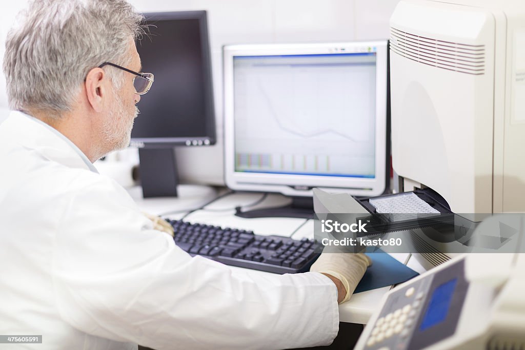 Life science researcher . Life science researcher  performing a genotyping testing which enables personalized medicine. PM is a medical model that proposes the customization of healthcare. Biological Cell Stock Photo