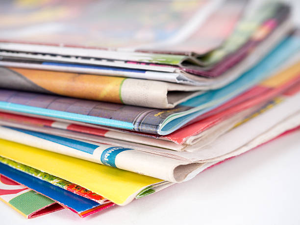 istock Pile of magazines on white 475605784