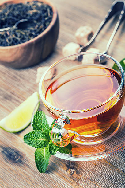 istock Tea in a glass cup, mint leaves 475605850