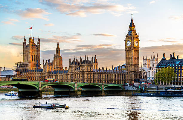 The Palace of Westminster in London in the evening The Palace of Westminster in London in the evening - England houses of parliament london stock pictures, royalty-free photos & images