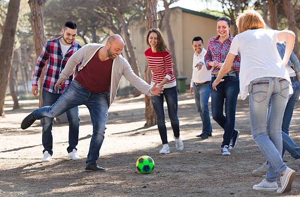 istock Friends playing football 475609624
