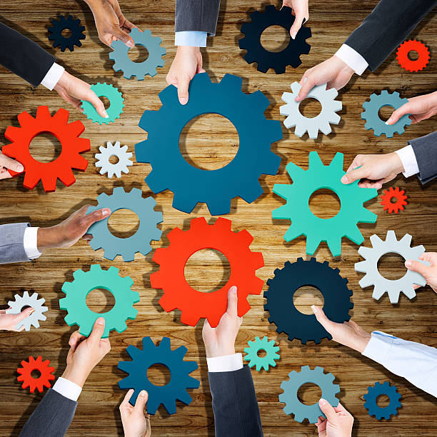istock Group of Business People Holding Gears 475609894