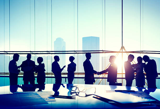 istock Silhouettes of Business People Working Discussion Concept 475610044
