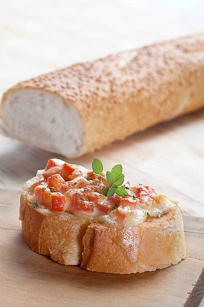 istock Bruschetta on board and baguette 475610142