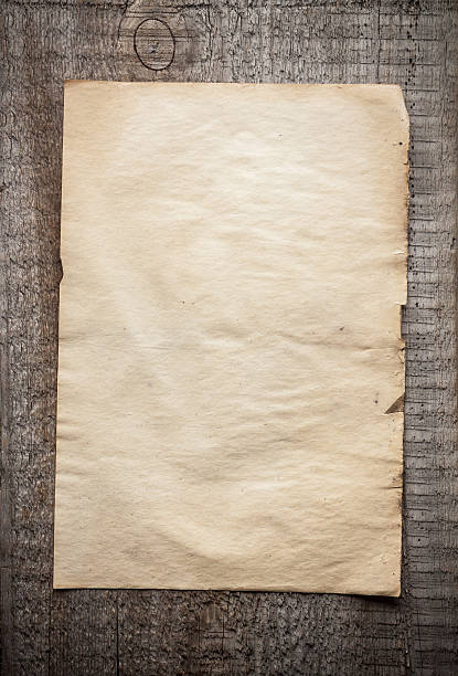 istock paper on wooden background 475613237