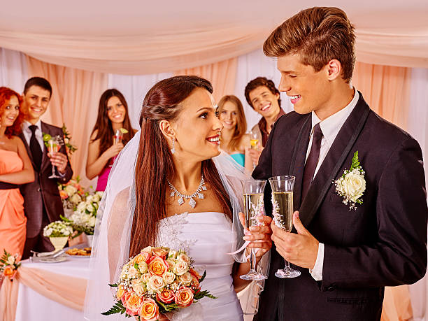 istock Wedding couple drinking champagne 475613982