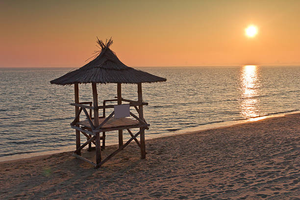 istock Lifeguard station at sunset 475614301