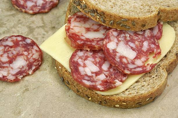istock Sandwich With Dried Smoked Sausages Slices And Cheese 475614314