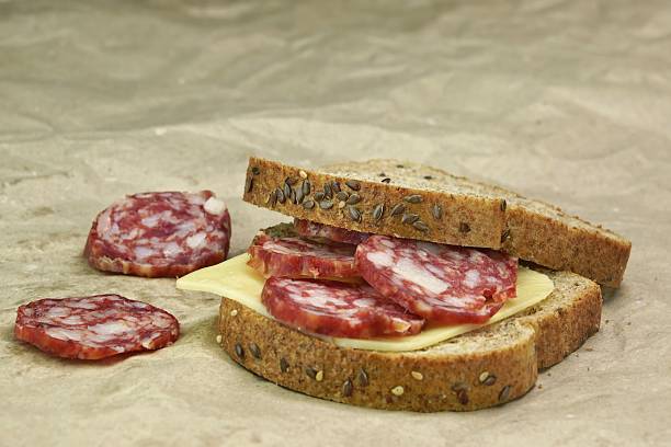 istock Sandwich With Dried Smoked Sausages Slices And Cheese 475614320