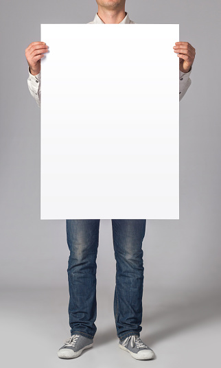 Man holding a blank poster