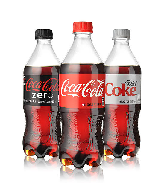 Coca-Cola bottles Los Angeles, California, USA - May 19, 2015: - Photo of Coca-Cola plastic bottles. Coca Cola is the most popular carbonated soft drink beverages sold around the world coke zero photos stock pictures, royalty-free photos & images