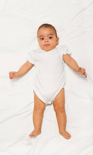 istock Chubby African small baby wearing white babygro 475618500
