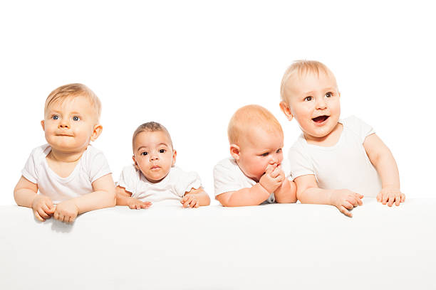 istock Cute babies stand in a row on the white background 475618536