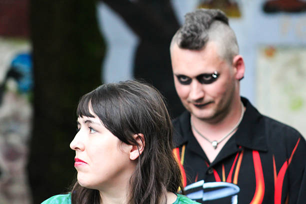 istock Man Sneaks Up on Woman 475618640