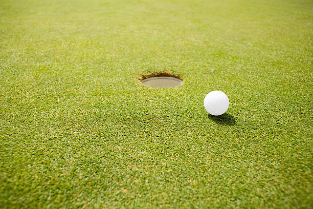 istock Golf ball near the hole 475623652