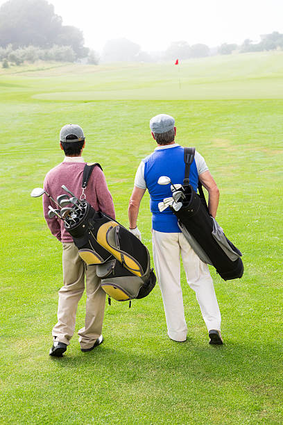 istock Golfer friends walking and chatting 475626234