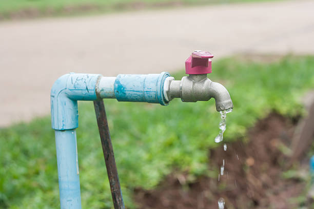 istock water running down from faucet 475627177