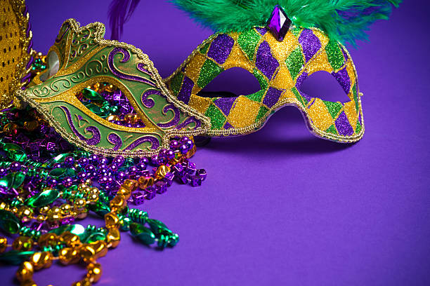 istock Assorted Mardi Gras or Carnivale masks on a purple background 475628149