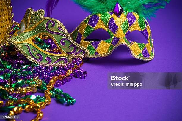 Assorted Mardi Gras Or Carnivale Masks On A Purple Background Stock Photo - Download Image Now