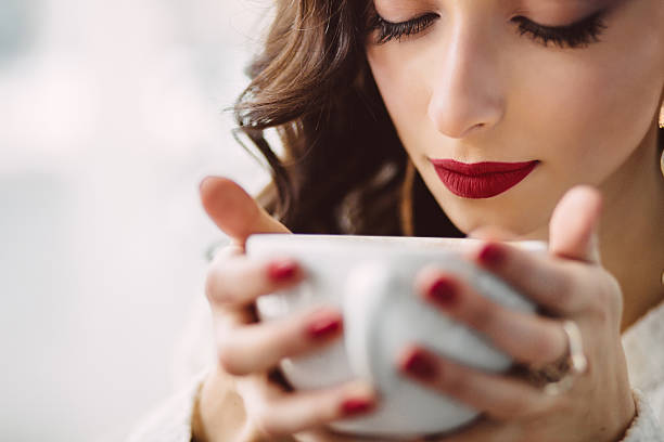 istock Young girl drinking coffee in a trendy cafe 475634053