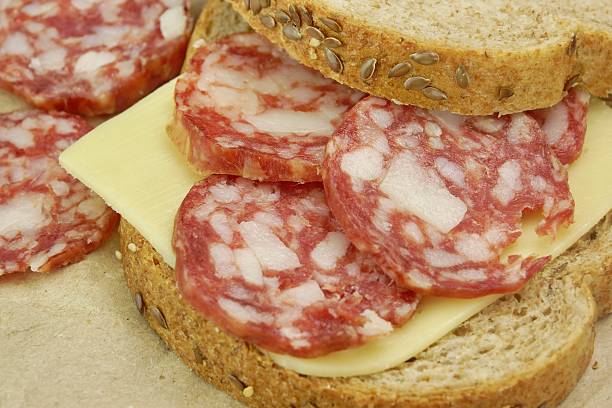istock Sandwich With Dried Smoked Sausages Slices And Cheese 475634802
