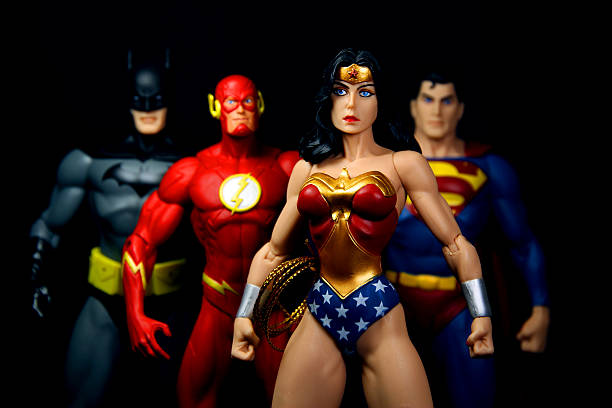 Strong Woman Vancouver, Canada - October 9, 2012: Action figure models of Wonder Woman, The Flash, Superman and Batman, released by DC comics, against a black background. action figure stock pictures, royalty-free photos & images