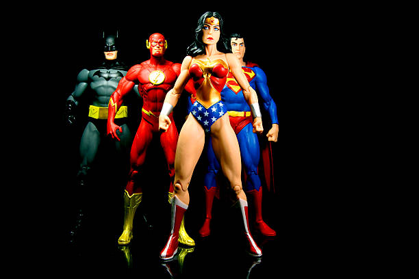 Strong Team Vancouver, Canada - October 9, 2012: Action figure models of Wonder Woman, The Flash, Superman and Batman, released by DC comics, against a black background. superman named work stock pictures, royalty-free photos & images