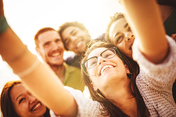 istock Group of friends laughing and doing a selfie 475636508