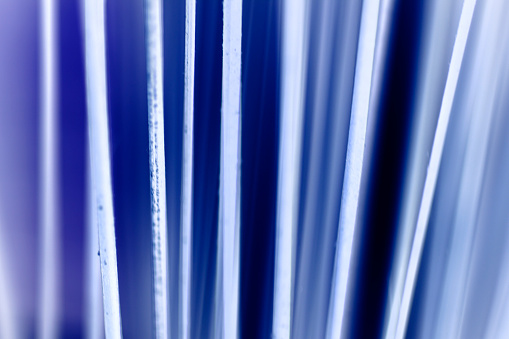 Unique abstract background with geometric lines or cables. Neon, blue hues in this modern, monochromatic background image. Futuristic, technology appearance. Many modern art concepts: psychedelic, speed, surrealism, ethereal, technology, energy, emergence, funky, techno, internet.