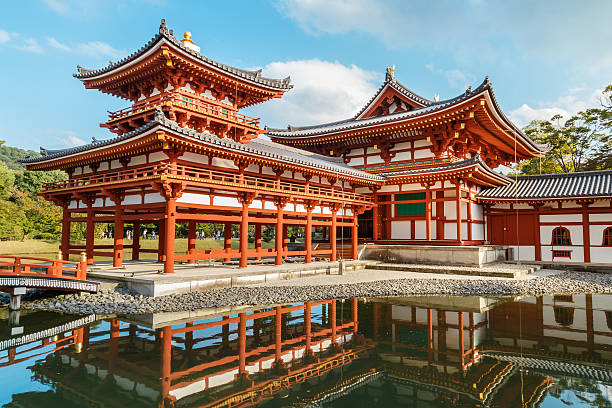 The Phoenix Hall of Byodo-in Temple in Kyoto Kyoto, Japan - October 21 2014: Byodoin temple built in 998 AD during the Heian period, originally a private residence and converted into a temple by a member of the Fujiwara clan in 1052 heian period stock pictures, royalty-free photos & images