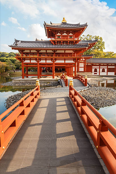 The Phoenix Hall of Byodo-in Temple in Kyoto Kyoto, Japan - October 21 2014: Byodoin temple built in 998 AD during the Heian period, originally a private residence and converted into a temple by a member of the Fujiwara clan in 1052 heian period stock pictures, royalty-free photos & images