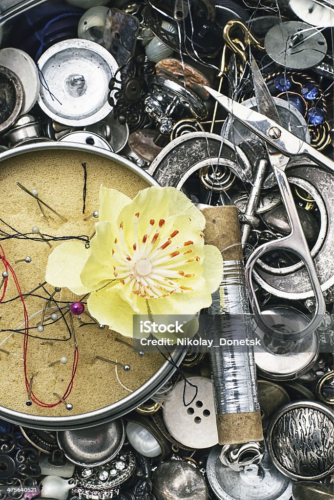 sewing accessories composition with sewing tools and floral decorations Basket Stock Photo