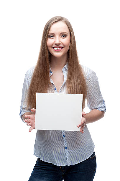istock businesswoman holding sign 475640531