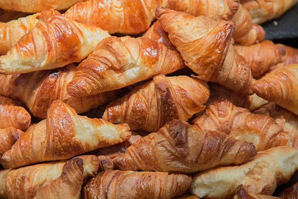 pile of croissants stock photo
