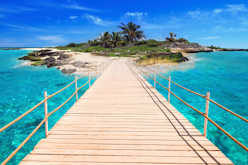 Pier to the tropical island of Caribbean Sea in Mexico