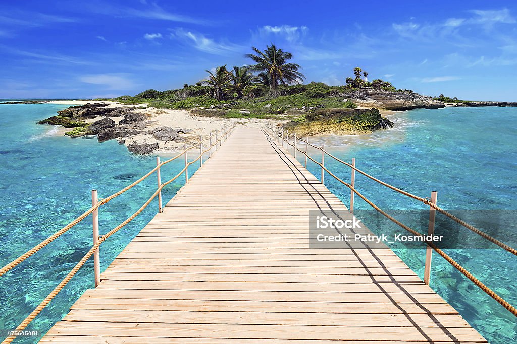 Pier to the tropical island of Caribbean Sea Pier to the tropical island of Caribbean Sea in Mexico Playa Del Carmen Stock Photo