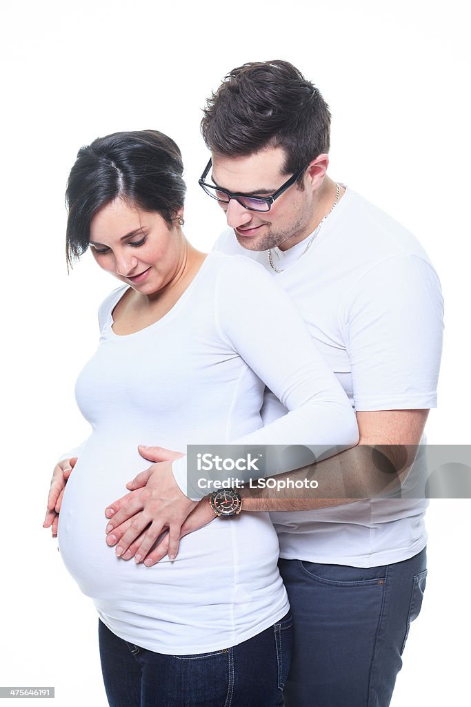 Pregnant Woman - Couple Look at Belly 20-24 Years Stock Photo