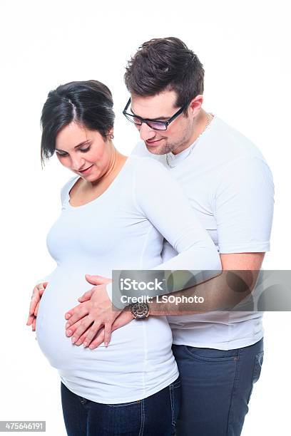 Pregnant Woman Couple Look At Belly Stock Photo - Download Image Now - 20-24 Years, Adult, Men