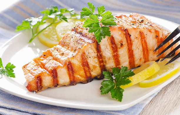 istock Grilled Salmon with lemon and  fresh herbs 475650906
