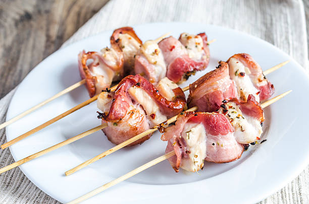 istock Grilled bacon skewers with chicken meat 475651457