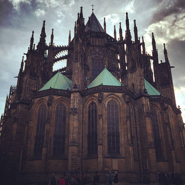 Prague, Czech Republic  - May 2, 2015: Tourists around famous St.Vitus Cathedral, Prague, backlit shot. 