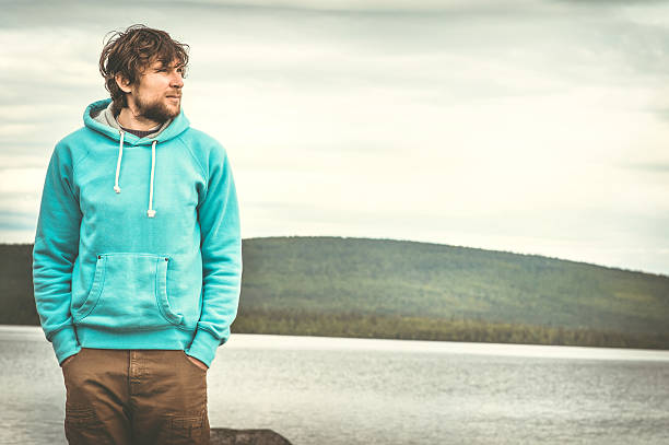 istock Young Man standing alone outdoor 475659856