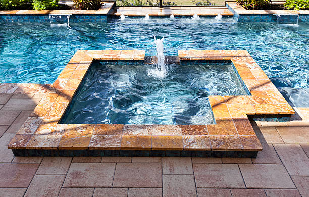 istock Custom swimming pool with spa and fountains 475660333
