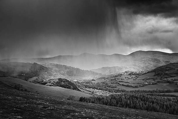 Black and white picture of a small town in a storm