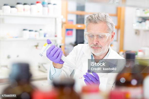 Life Scientist Researching In The Laboratory Stock Photo - Download Image Now - Adult, Adults Only, Analyzing