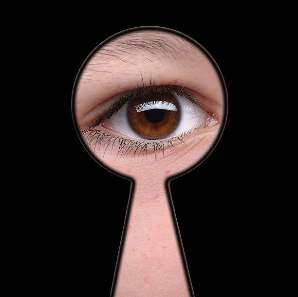 istock Man see you! - man looking through keyhole 475660661