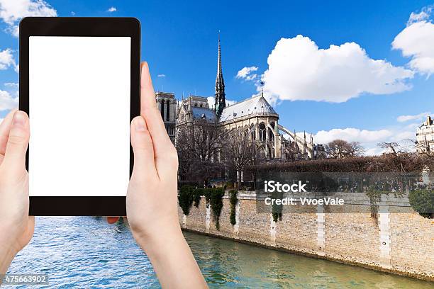 Tourist Photographs Cathedral Notre Dame In Paris Stock Photo - Download Image Now - 2015, Arranging, Basilica
