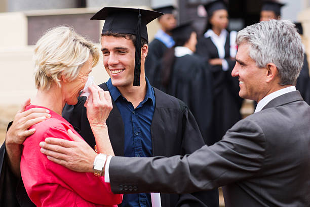istock proud mother at her son's graduation 475664939