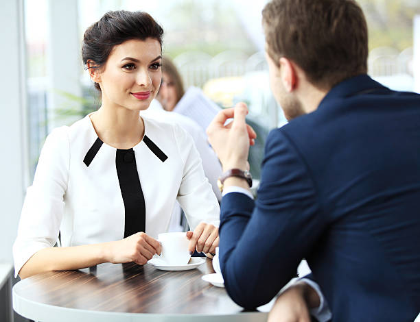 istock Young couple of professionals chatting during a coffee break 475666238