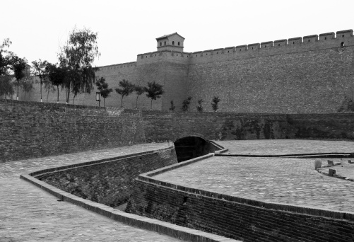 black and white; vintage style photo of the city walls and moat of Pingyao, china